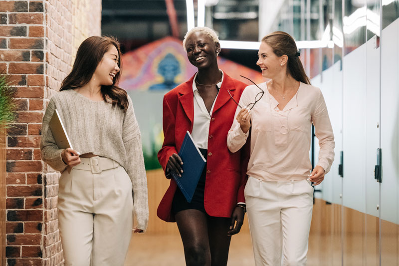 Women walking and smiling